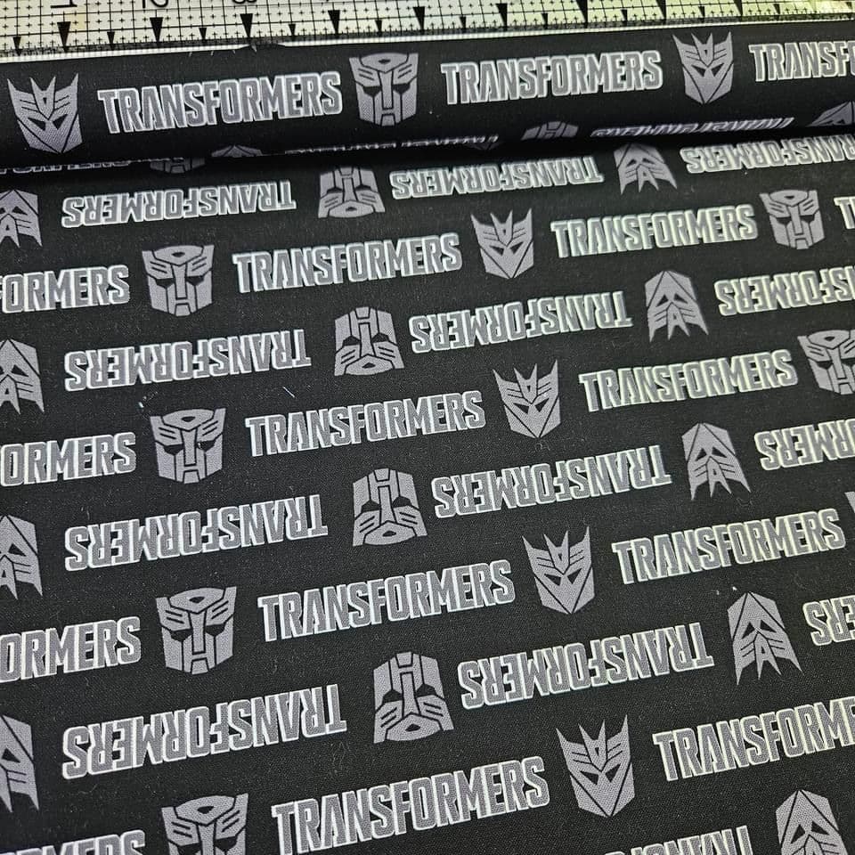 Camelot Cottons - Transformers Logo Autobots Decepticons Black 100% Cotton Fabric