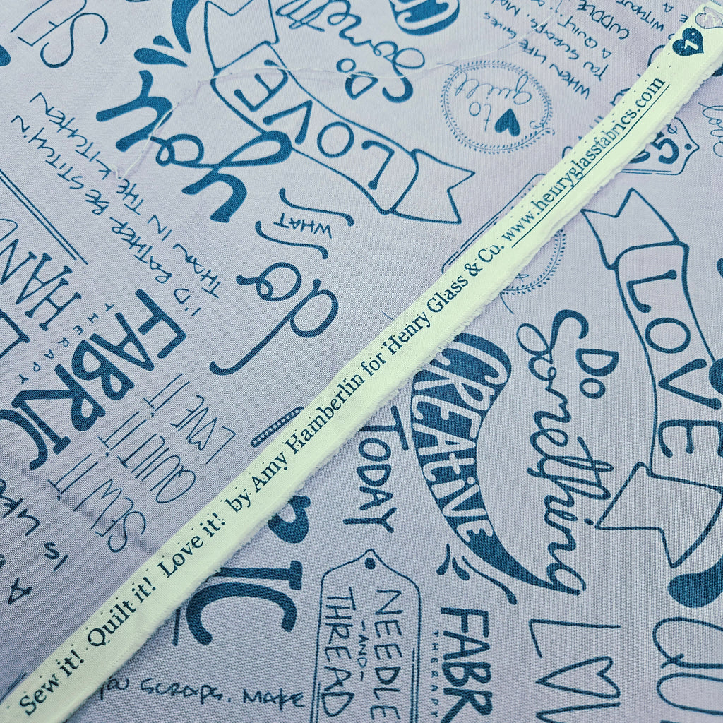 Henry Glass - Sew it! Quilt it! Love it! Quotes Purple 100% Cotton Fabric - Crafts and Quilts